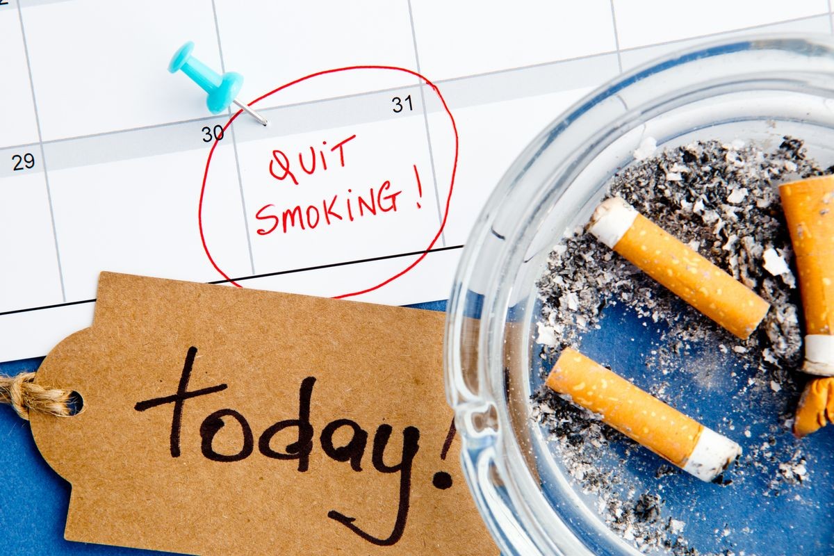 Quit Smoking - Calendar - Today - with ashtray and handwritten tag on blue background
